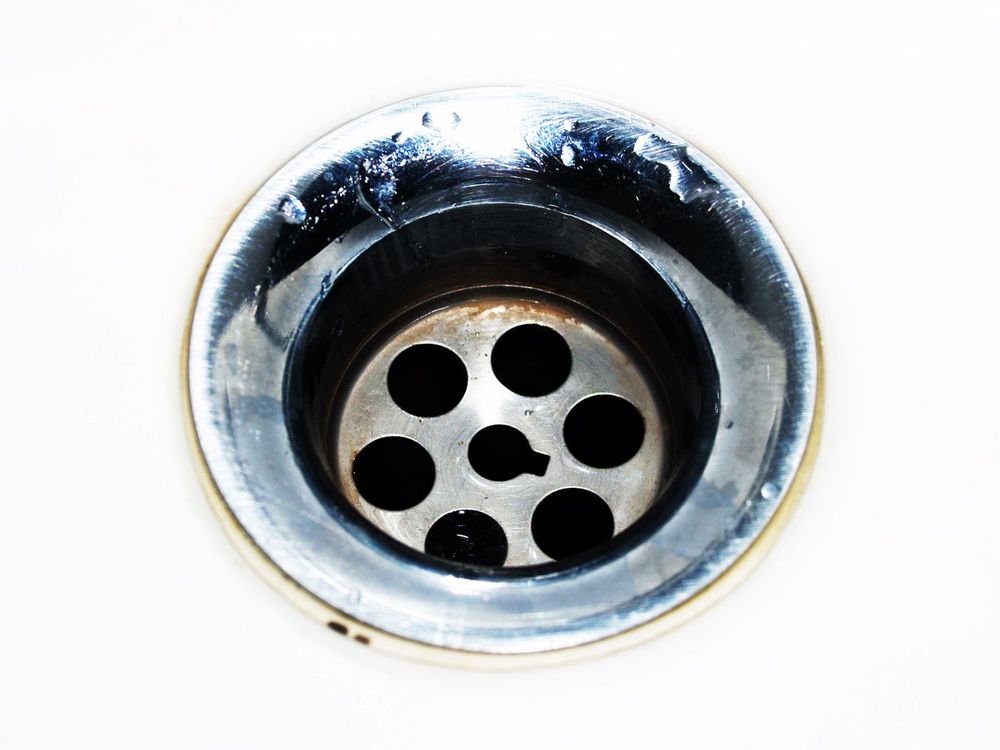 Close-up of a chrome sink drain